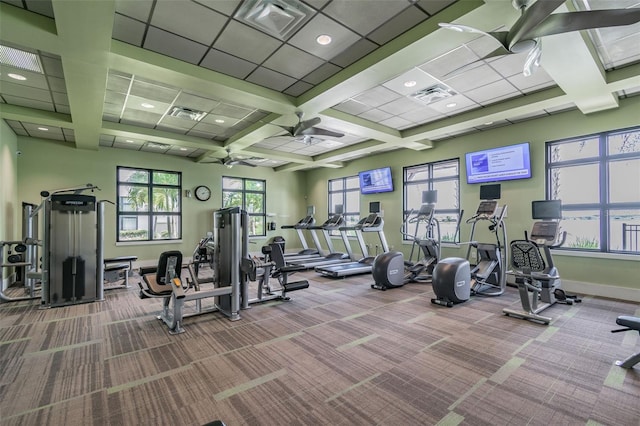 workout area with visible vents, baseboards, and carpet