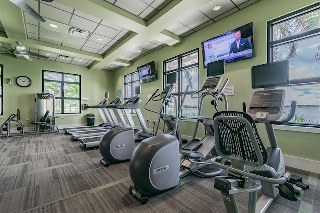 workout area with carpet flooring, baseboards, a paneled ceiling, and visible vents