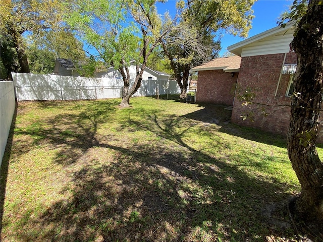 view of yard featuring fence