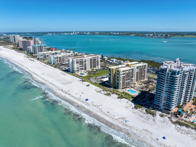 drone / aerial view with a view of city, a beach view, and a water view