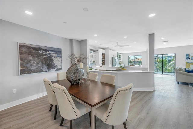 dining space with recessed lighting, ceiling fan, light wood-type flooring, and baseboards