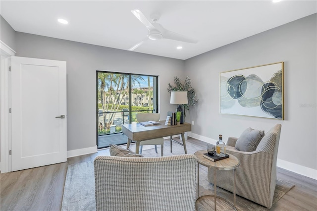 home office featuring wood finished floors, baseboards, and ceiling fan