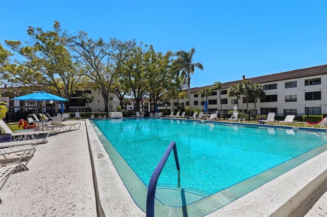 community pool with a patio area