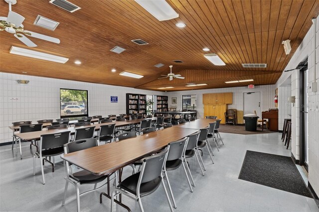 dining area with visible vents, wood ceiling, and vaulted ceiling