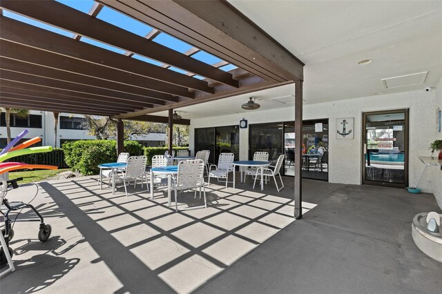 view of patio featuring outdoor dining area and a pergola