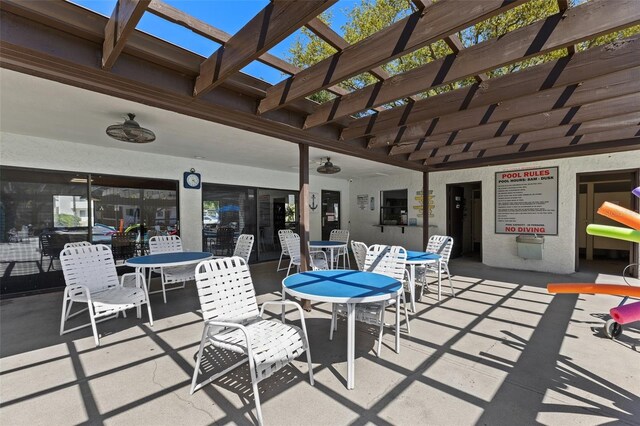 view of patio / terrace with outdoor dining area and a pergola