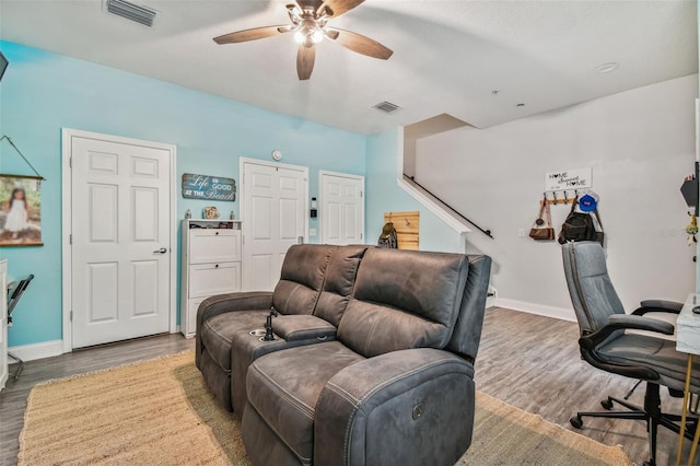 office area featuring baseboards, wood finished floors, visible vents, and ceiling fan