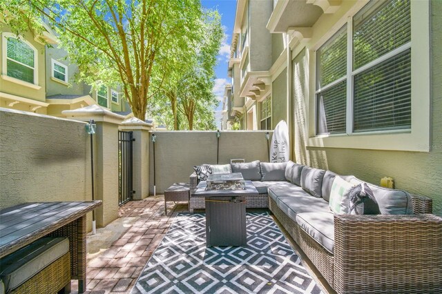 view of patio / terrace with outdoor lounge area and fence