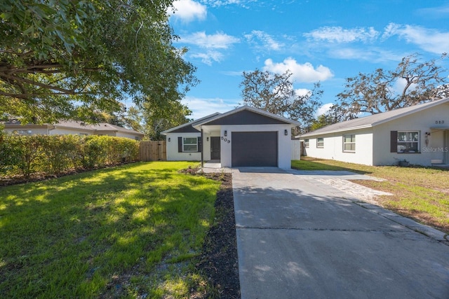 ranch-style home featuring fence, driveway, stucco siding, a front lawn, and a garage