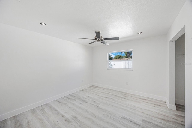 unfurnished bedroom featuring recessed lighting, baseboards, and light wood finished floors