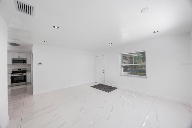 interior space featuring baseboards, visible vents, and marble finish floor