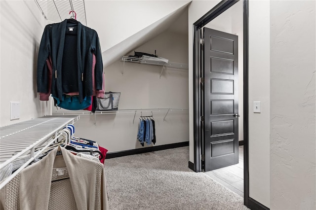 walk in closet featuring carpet