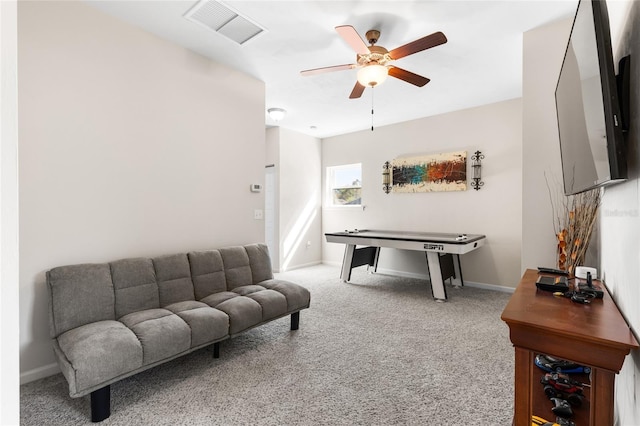 recreation room featuring carpet flooring, baseboards, visible vents, and ceiling fan