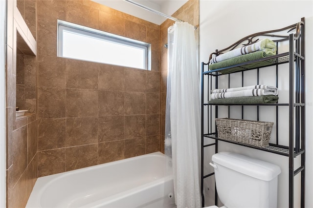 bathroom featuring toilet and shower / bath combo