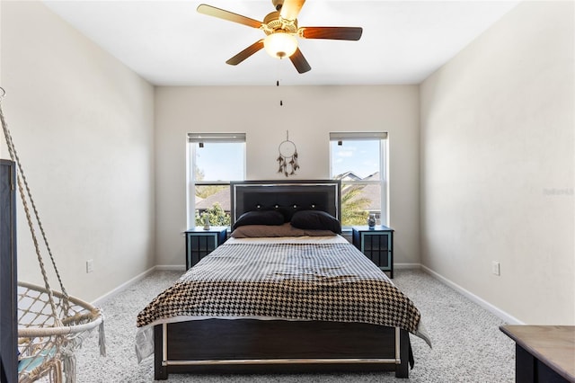 bedroom featuring multiple windows, baseboards, and carpet floors