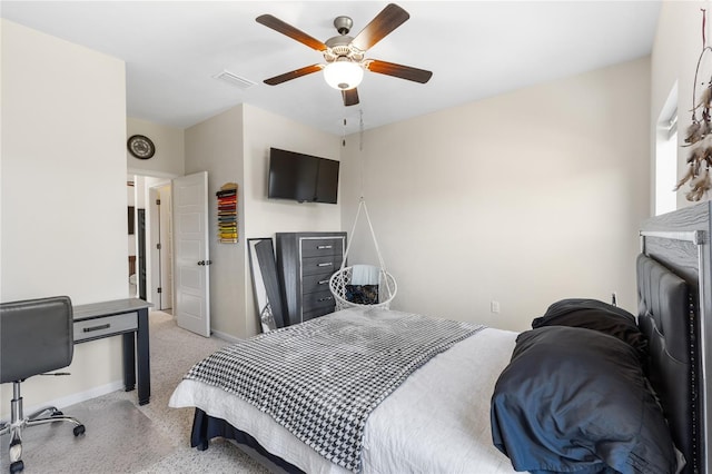 bedroom featuring light carpet, visible vents, baseboards, and ceiling fan