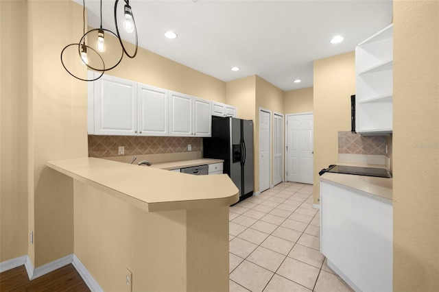 kitchen with white cabinetry, open shelves, refrigerator with ice dispenser, and light countertops