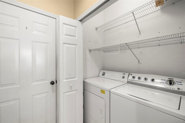 laundry room featuring washer and dryer and laundry area