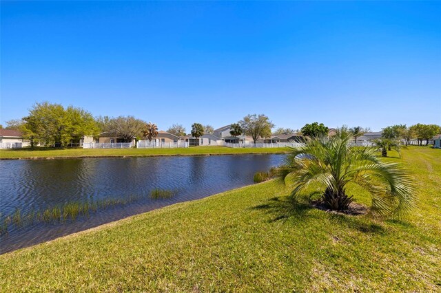 water view with a residential view and fence