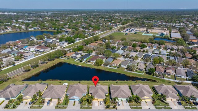 birds eye view of property featuring a residential view and a water view