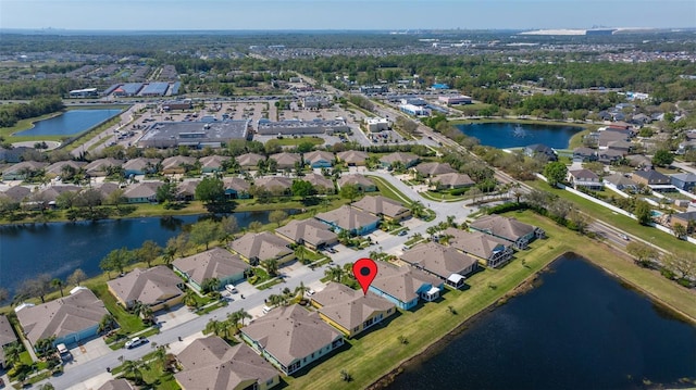 aerial view featuring a residential view and a water view