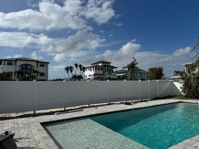 view of pool featuring a fenced in pool, a patio, and a fenced backyard