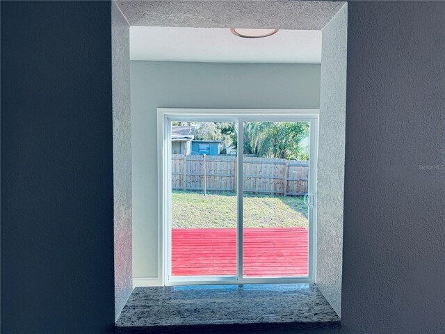 1409 Franklin St, Clearwater, FL 33756 - doorway with a textured wall