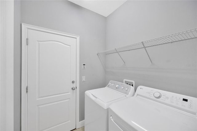 laundry area featuring laundry area and washer and dryer