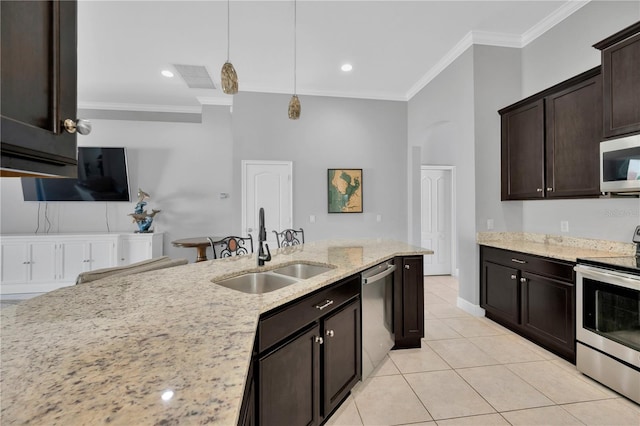 kitchen with visible vents, decorative light fixtures, ornamental molding, appliances with stainless steel finishes, and a sink