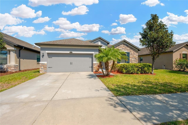 single story home with a front yard, stucco siding, concrete driveway, a garage, and stone siding