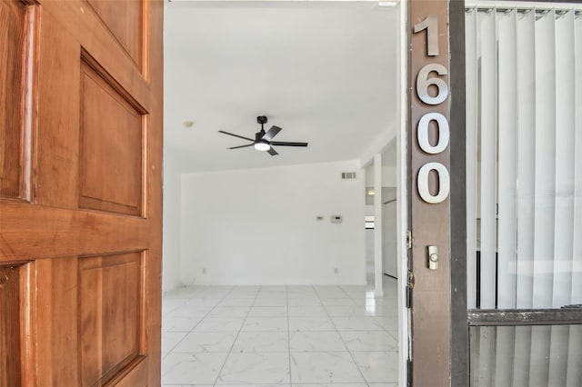 interior space featuring visible vents, marble finish floor, and ceiling fan