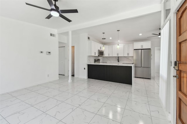 kitchen featuring visible vents, ceiling fan, light countertops, appliances with stainless steel finishes, and marble finish floor