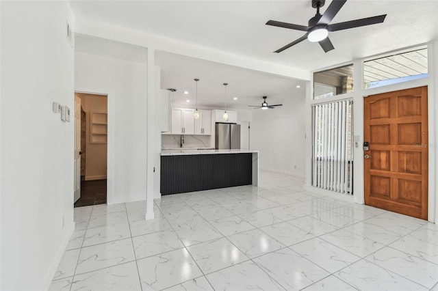 interior space with recessed lighting, baseboards, marble finish floor, and ceiling fan