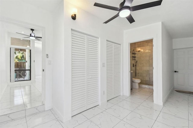 interior space with marble finish floor, a closet, and ceiling fan