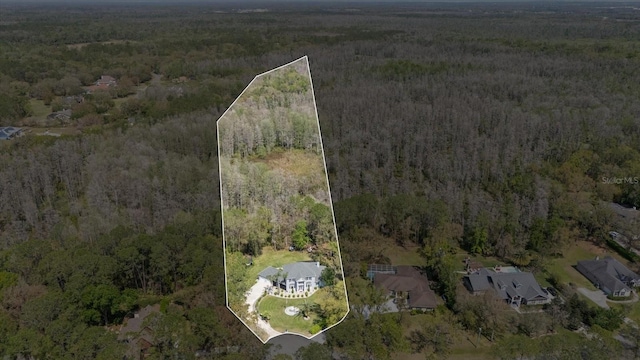 aerial view featuring a forest view