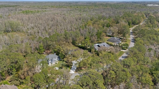 drone / aerial view featuring a view of trees