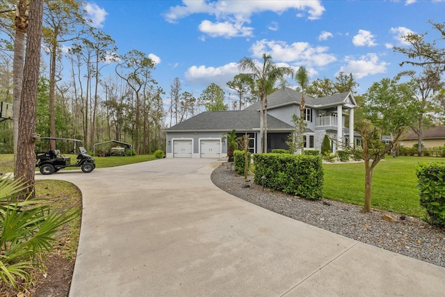 view of home's exterior with a balcony, driveway, stucco siding, a garage, and a lawn