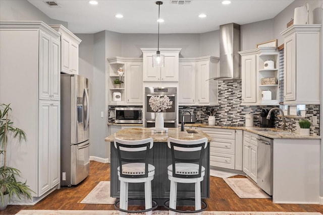 kitchen featuring open shelves, stainless steel appliances, wall chimney exhaust hood, and white cabinets