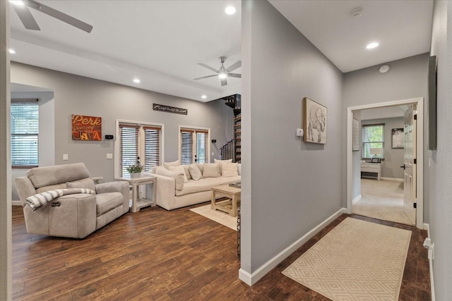 living room with dark wood-type flooring, stairway, recessed lighting, and ceiling fan