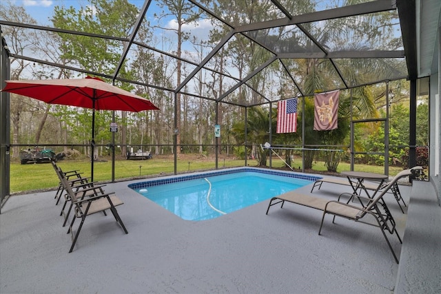 pool featuring a lawn, a lanai, and a patio area