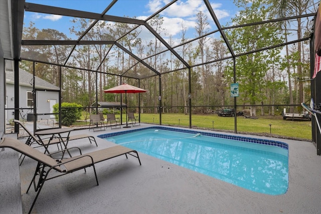 outdoor pool with glass enclosure, a yard, and a patio area