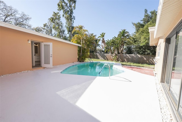 view of pool featuring a fenced in pool, a patio, and fence