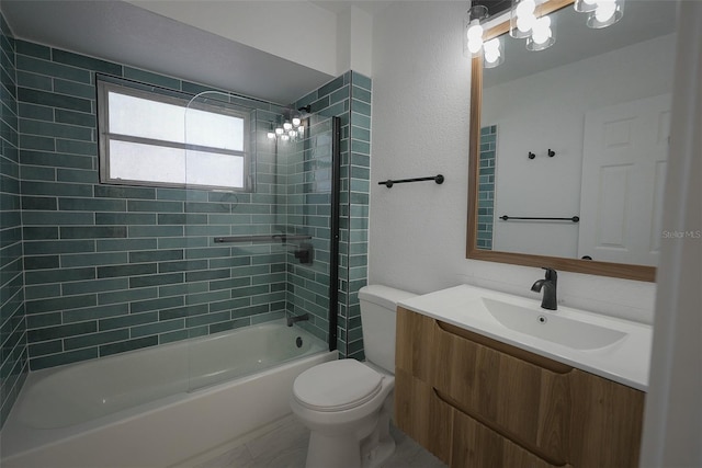 bathroom with bathtub / shower combination, toilet, and vanity