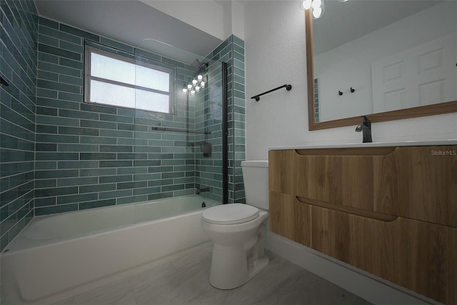 bathroom with toilet, vanity, and bathing tub / shower combination