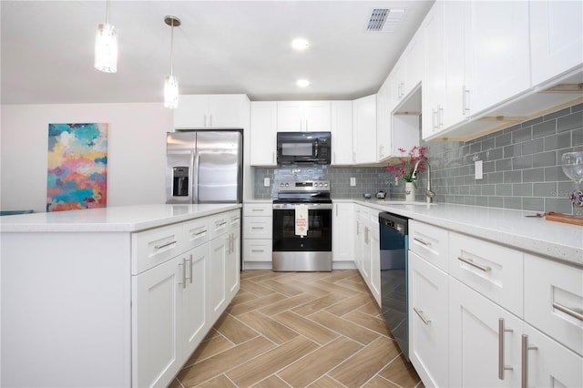 kitchen with a sink, stainless steel appliances, decorative backsplash, and light countertops