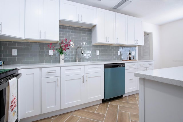 1902 Andover St Unit 198, Sun City Center, FL 33573 - kitchen with dishwashing machine, electric stove, a sink, and white cabinetry