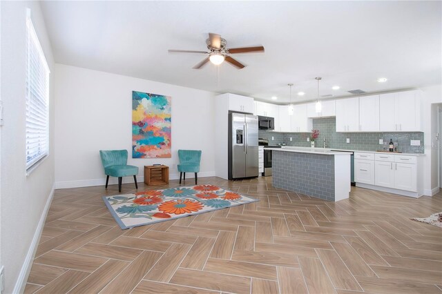 1902 Andover St Unit 198, Sun City Center, FL 33573 - kitchen featuring stainless steel appliances, baseboards, a ceiling fan, light countertops, and recessed lighting