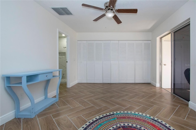 1902 Andover St Unit 198, Sun City Center, FL 33573 - unfurnished bedroom with baseboards, ceiling fan, and connected bathroom