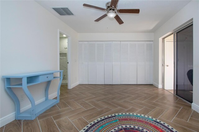 1902 Andover St Unit 198, Sun City Center, FL 33573 - unfurnished bedroom with baseboards, ceiling fan, and connected bathroom