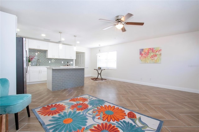 1902 Andover St Unit 198, Sun City Center, FL 33573 - kitchen with freestanding refrigerator, baseboards, a kitchen island, light countertops, and recessed lighting